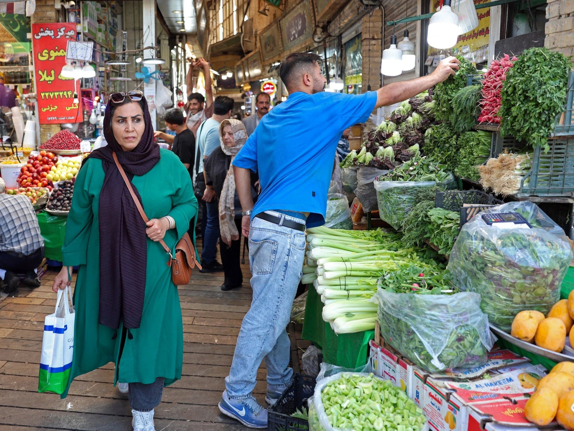 Iran's leaders acknowledge 35% trade slump, pledge diplomacy and defence