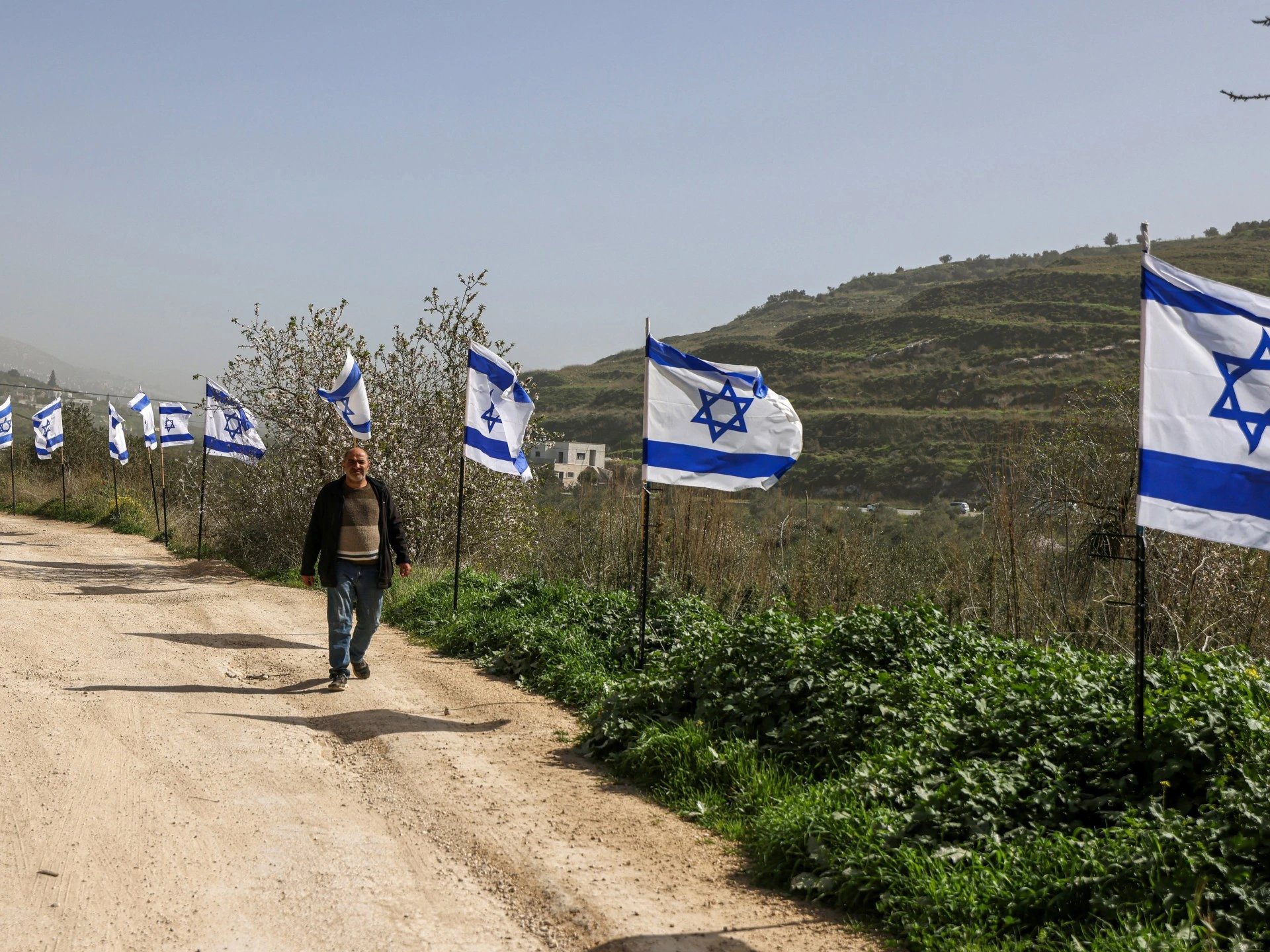 Israeli flags and mobile outposts reshape West Bank landscape, Palestinians say