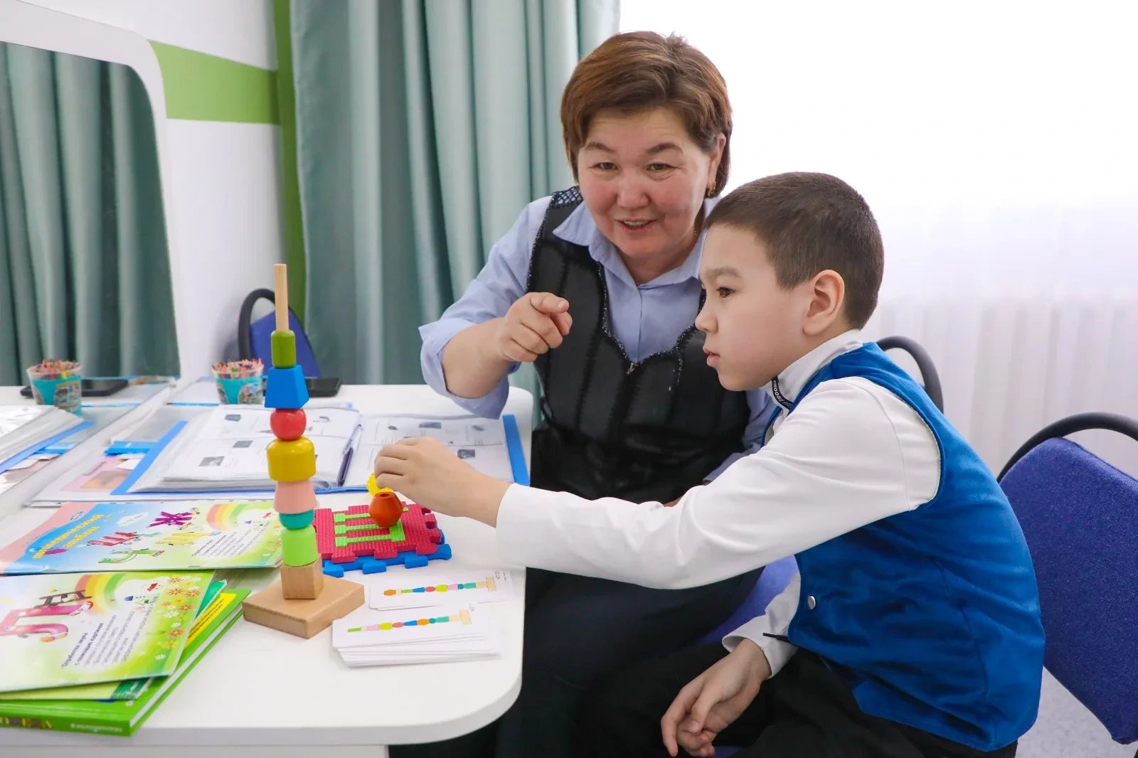 Tokayev signs law mandating support centers for children with special needs