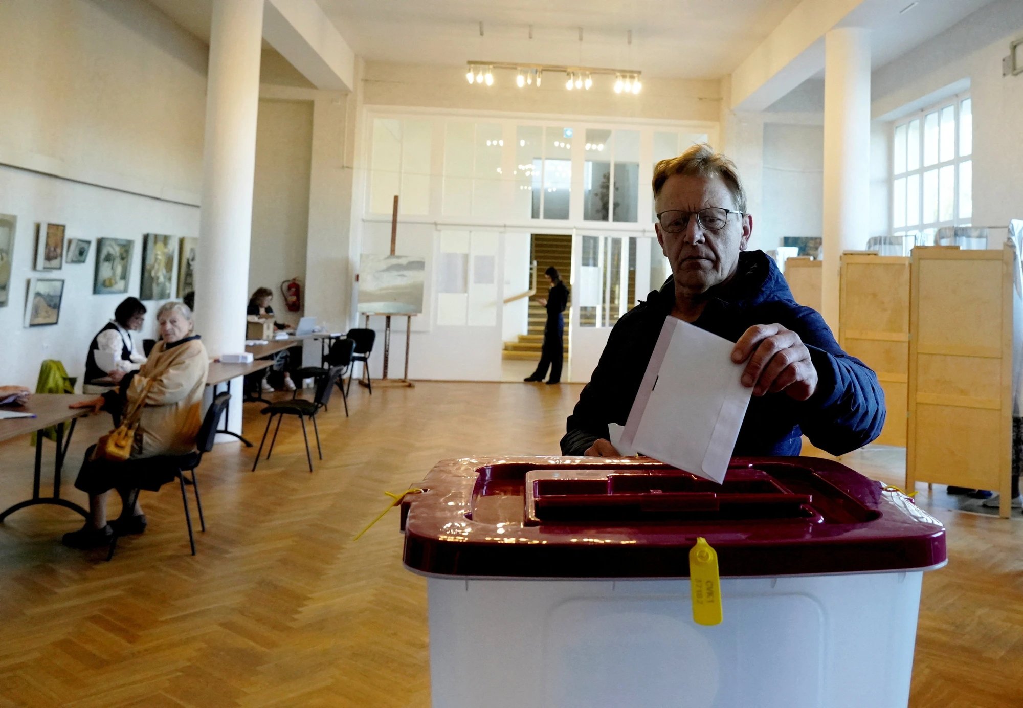 Latvia votes in election dominated by Russia, inflation concerns