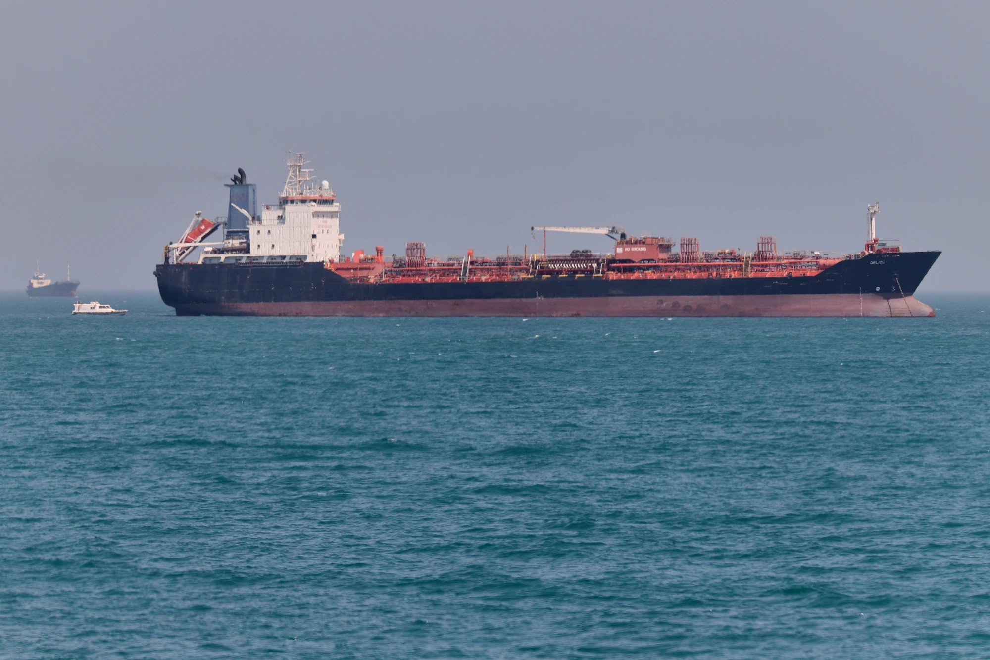 Mixed Washington-Tehran signals compound Gulf economic strain as Hormuz traffic slows